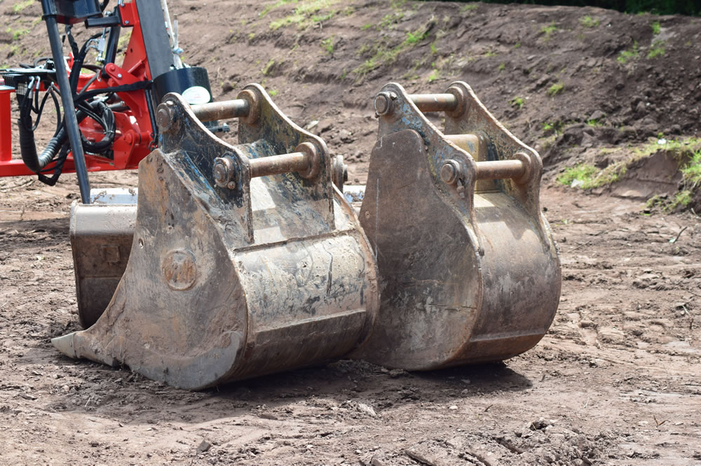 Groundworks preparation with digger buckets, Monmouthshire, South Wales